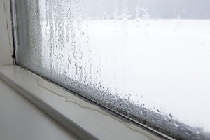 Strong humidity at a window in wintertime
